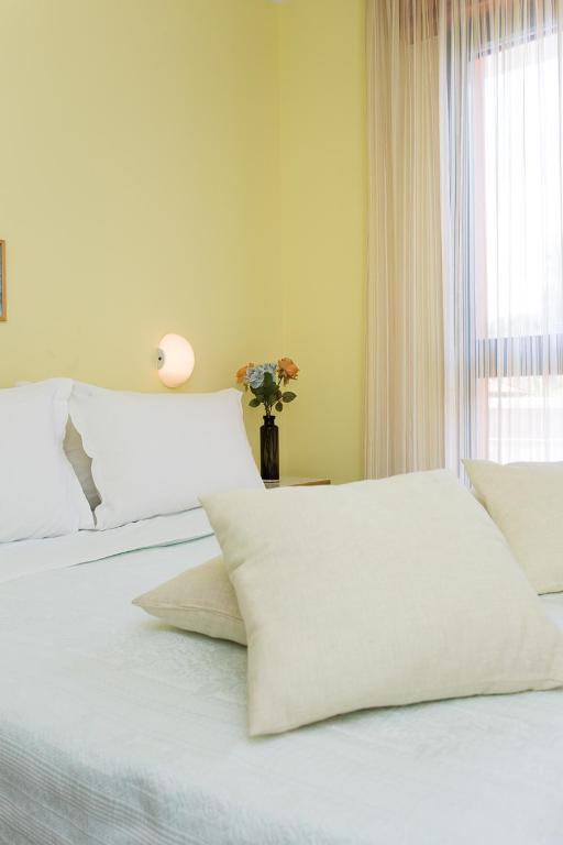 Postel nebo postele na pokoji v ubytování Hotel Valentino