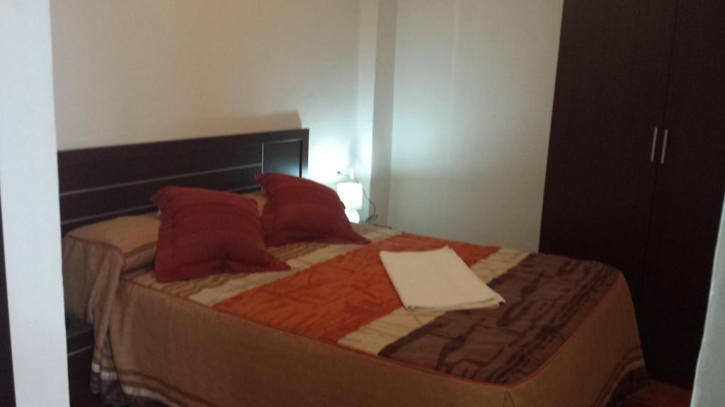 Łóżko lub łóżka w pokoju w obiekcie Pension Gran Plaza