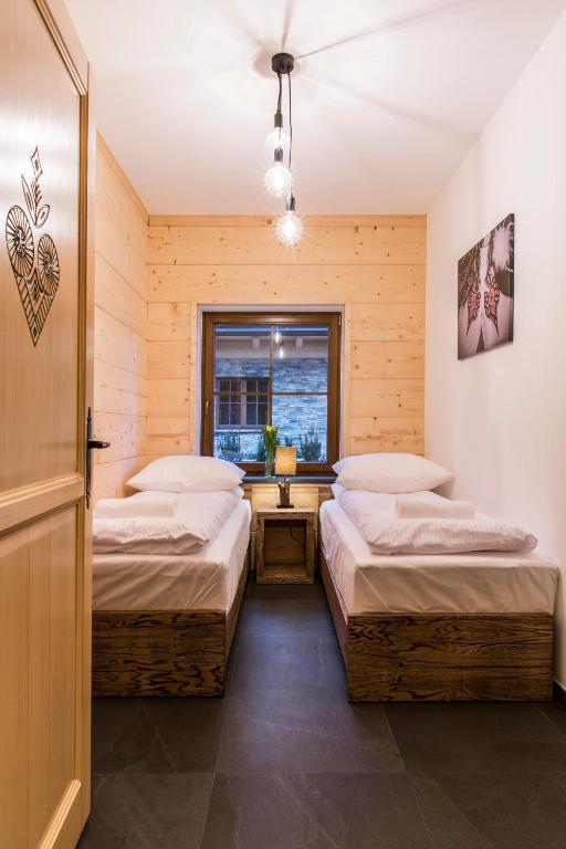 Posteľ alebo postele v izbe v ubytovaní udanypobyt Apartamenty Czorsztyn