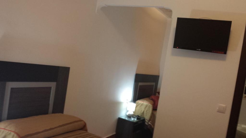 Telewizja i/lub zestaw kina domowego w obiekcie Pension Gran Plaza