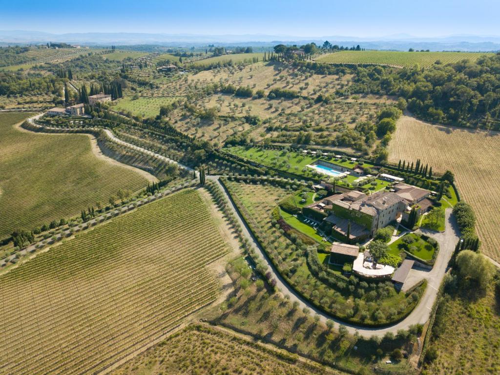 an aerial view of a house in a field at Hotel Le Fontanelle in Castelnuovo Berardenga