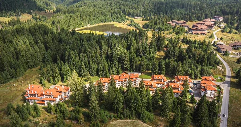 an aerial view of a resort in a forest at Lake View Apartment in Pamporovo