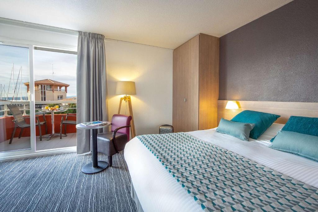 Postel nebo postele na pokoji v ubytování Best Western Plus La Marina