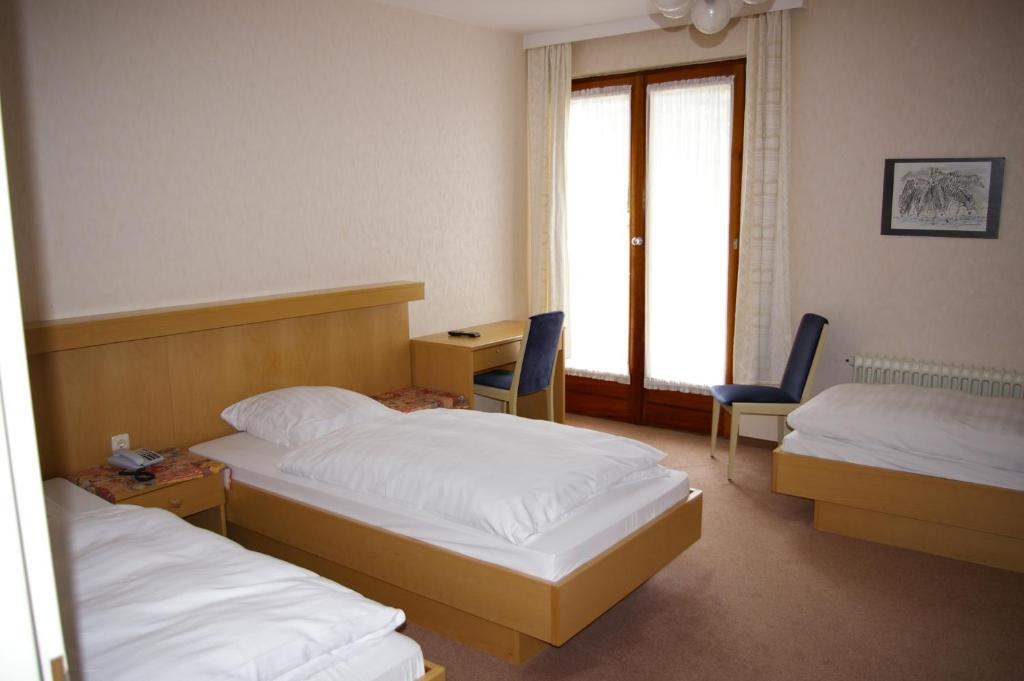 Postel nebo postele na pokoji v ubytování Hotel Herrenrest