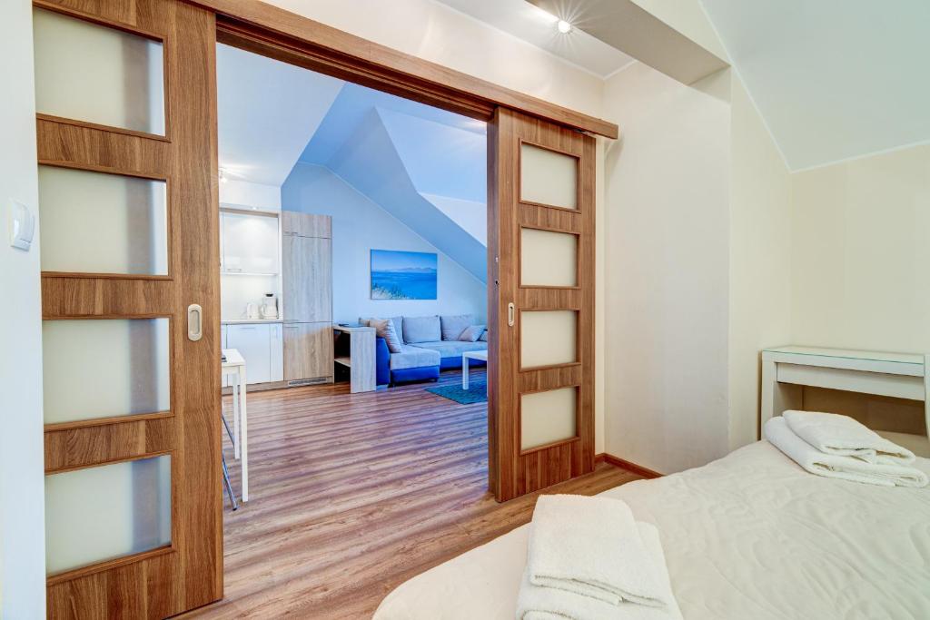 Postel nebo postele na pokoji v ubytování Apartamenty Zdrojowa