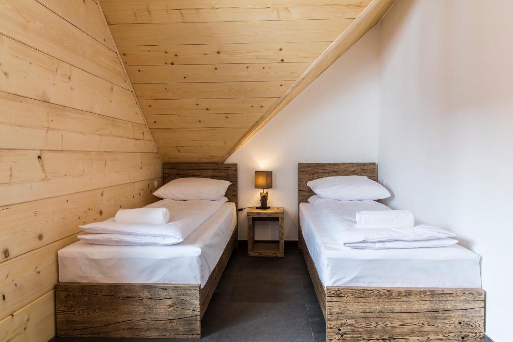 Posteľ alebo postele v izbe v ubytovaní udanypobyt Apartamenty Czorsztyn