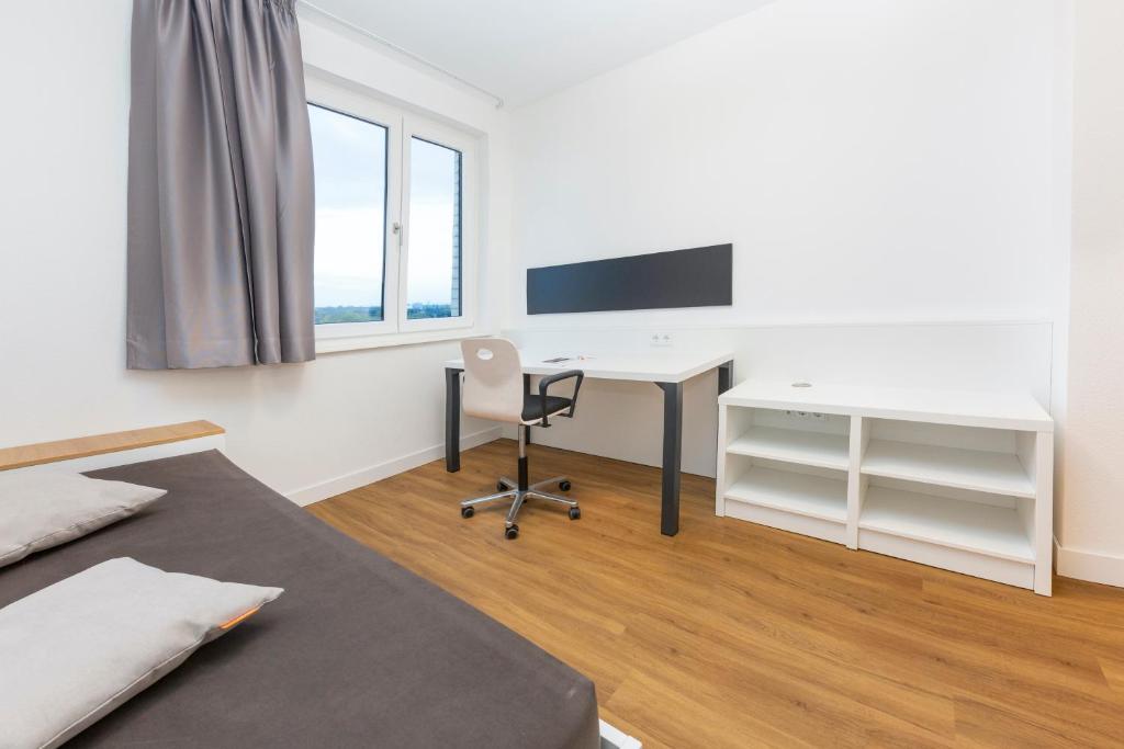 A television and/or entertainment centre at smartments Graz