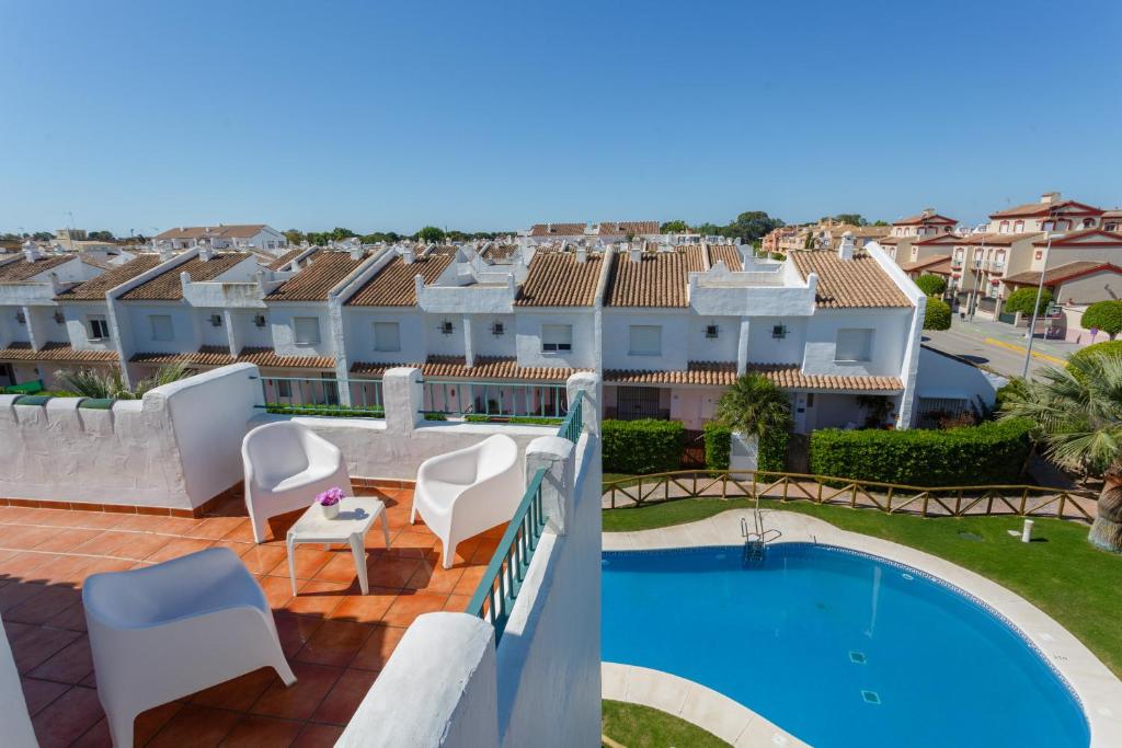 a view from the balcony of a villa with a swimming pool at Atico La LUZ-Rota free parking by Cadiz4Rentals in Rota