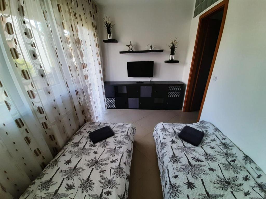 Posteľ alebo postele v izbe v ubytovaní Promenade Apartman