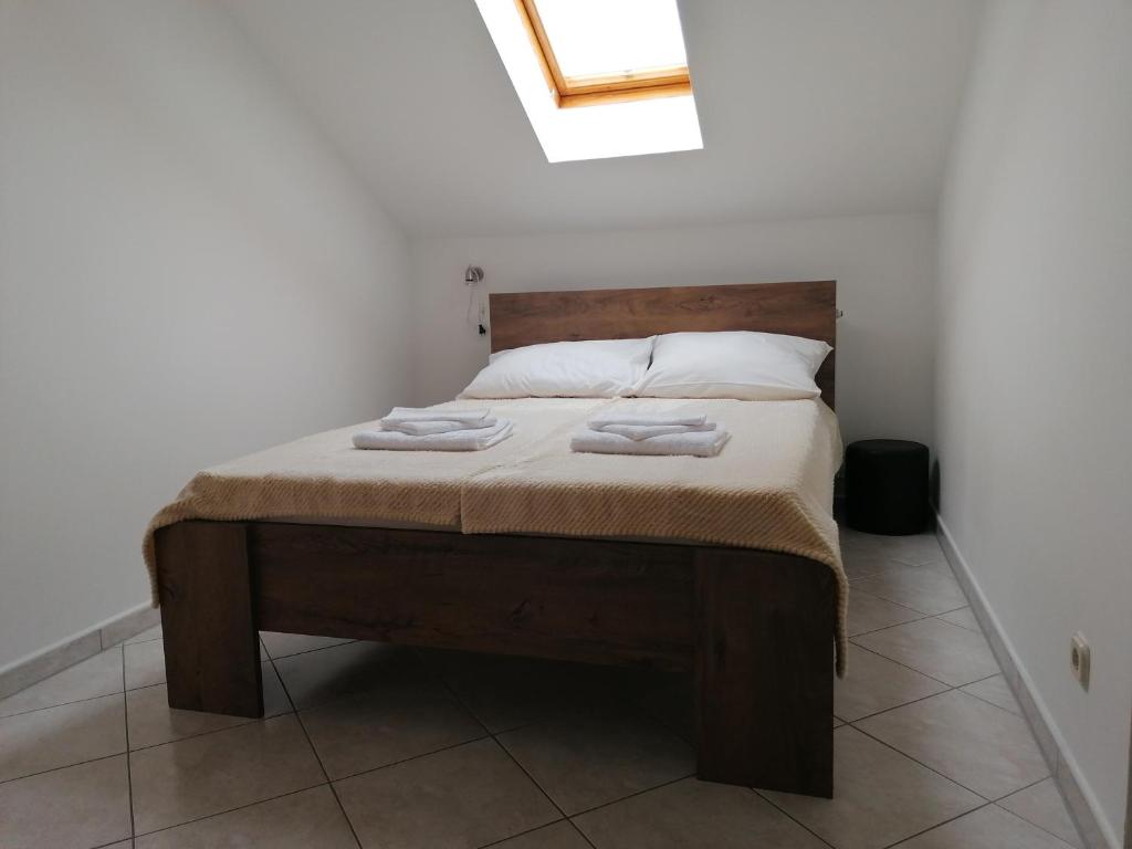 Postel nebo postele na pokoji v ubytování Apartmani Stille