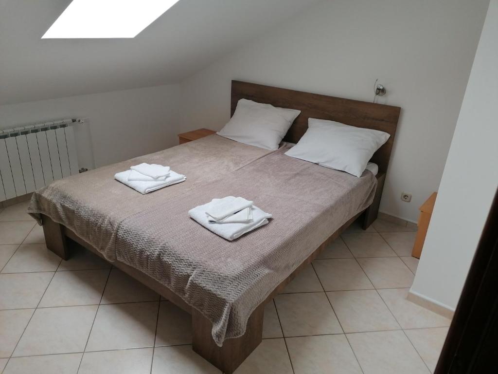 Postel nebo postele na pokoji v ubytování Apartmani Stille
