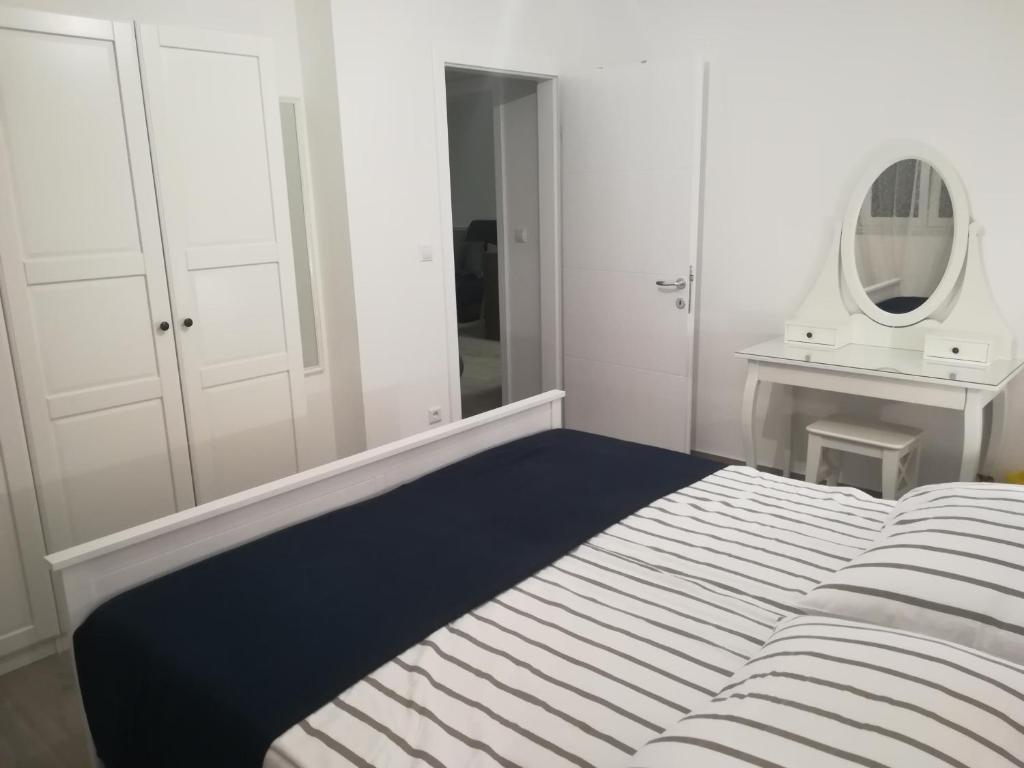 Posteľ alebo postele v izbe v ubytovaní Apartment ANTONELLA