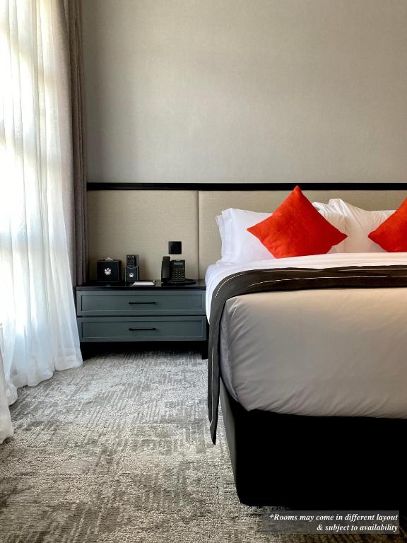 Postel nebo postele na pokoji v ubytování Stanton Hotel