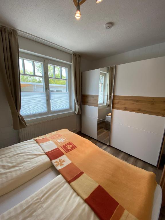 Postel nebo postele na pokoji v ubytování Appartementhaus Nolting