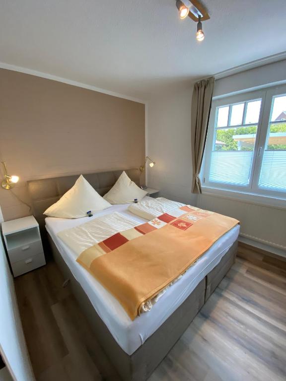 Postel nebo postele na pokoji v ubytování Appartementhaus Nolting