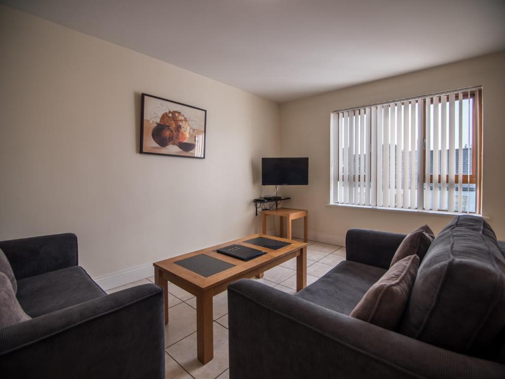 TV a/nebo společenská místnost v ubytování Donegan Court Aparthotel