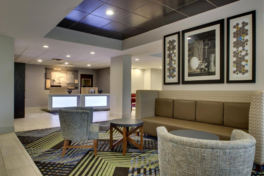 a lobby with a couch and chairs and a table at Holiday Inn Express - Horse Cave, an IHG Hotel in Horse Cave