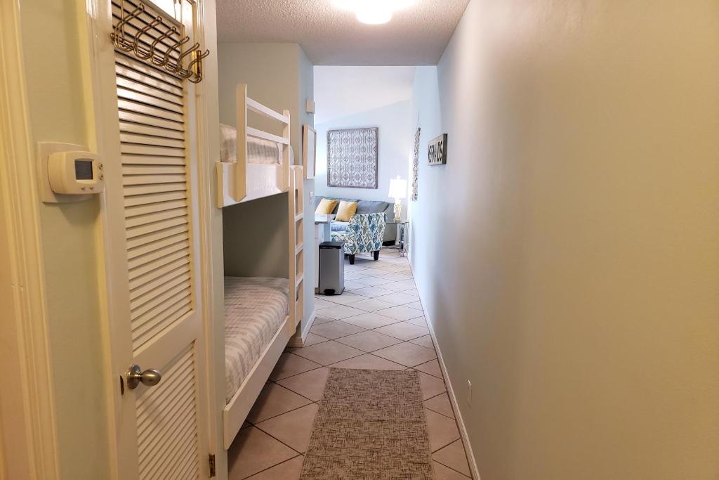 a hallway with a door leading to a room at Gulf View II in Destin