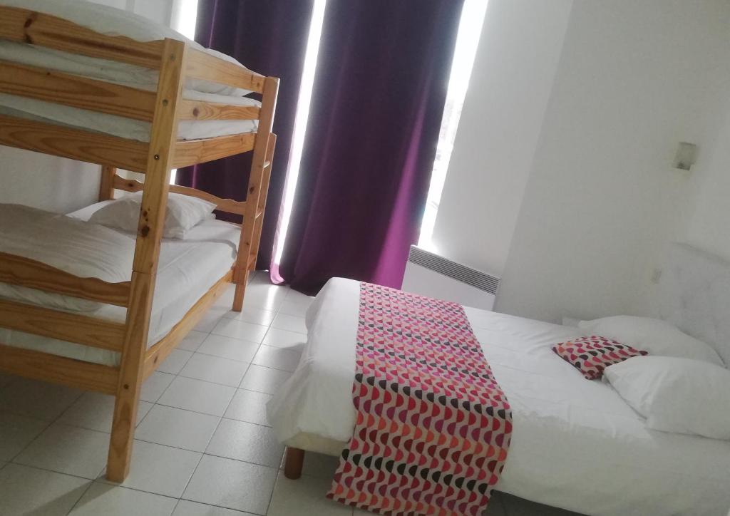 Postel nebo postele na pokoji v ubytování Hotel La Clé