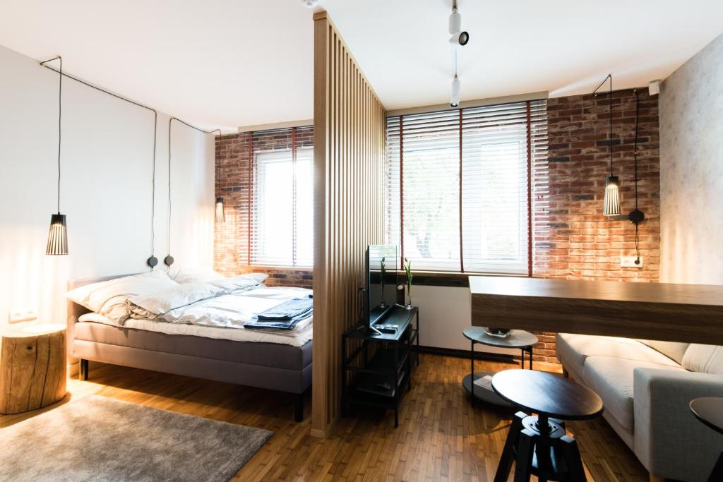 a bedroom with a bed and a desk in a room at Apartament Solna - jedyny taki #Lublin in Lublin