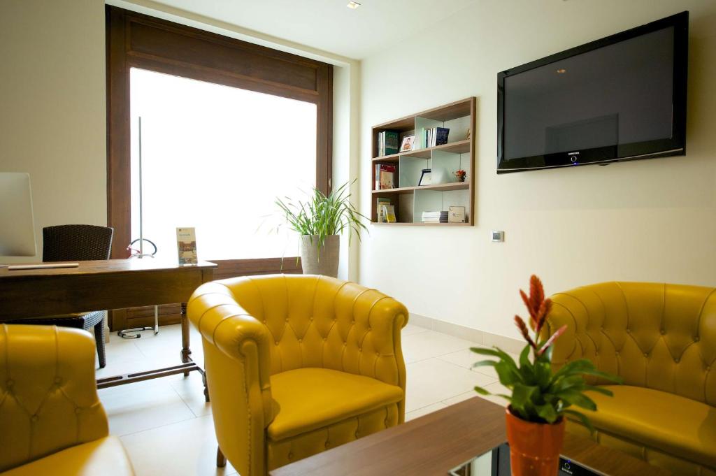 TV a/nebo společenská místnost v ubytování Best Western Hotel Luxor