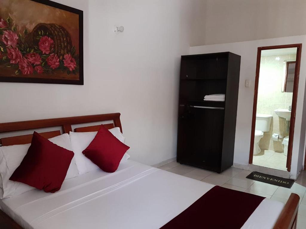 Postel nebo postele na pokoji v ubytování Hotel Don Juan Colonial