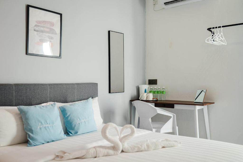Postel nebo postele na pokoji v ubytování Perfect Hub Semporna