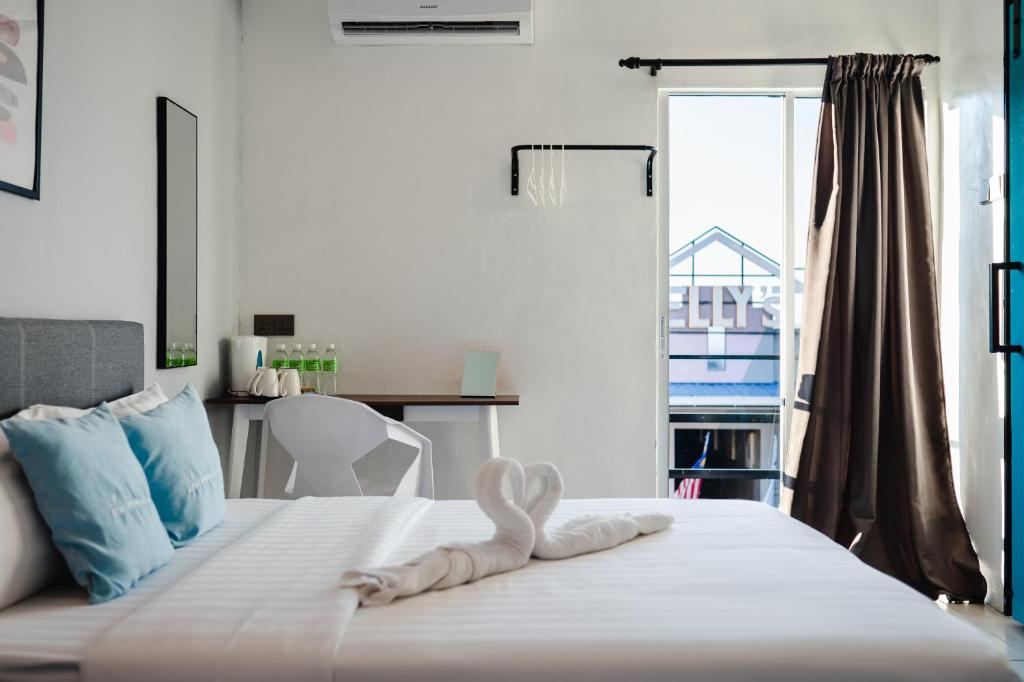 Postel nebo postele na pokoji v ubytování Perfect Hub Semporna