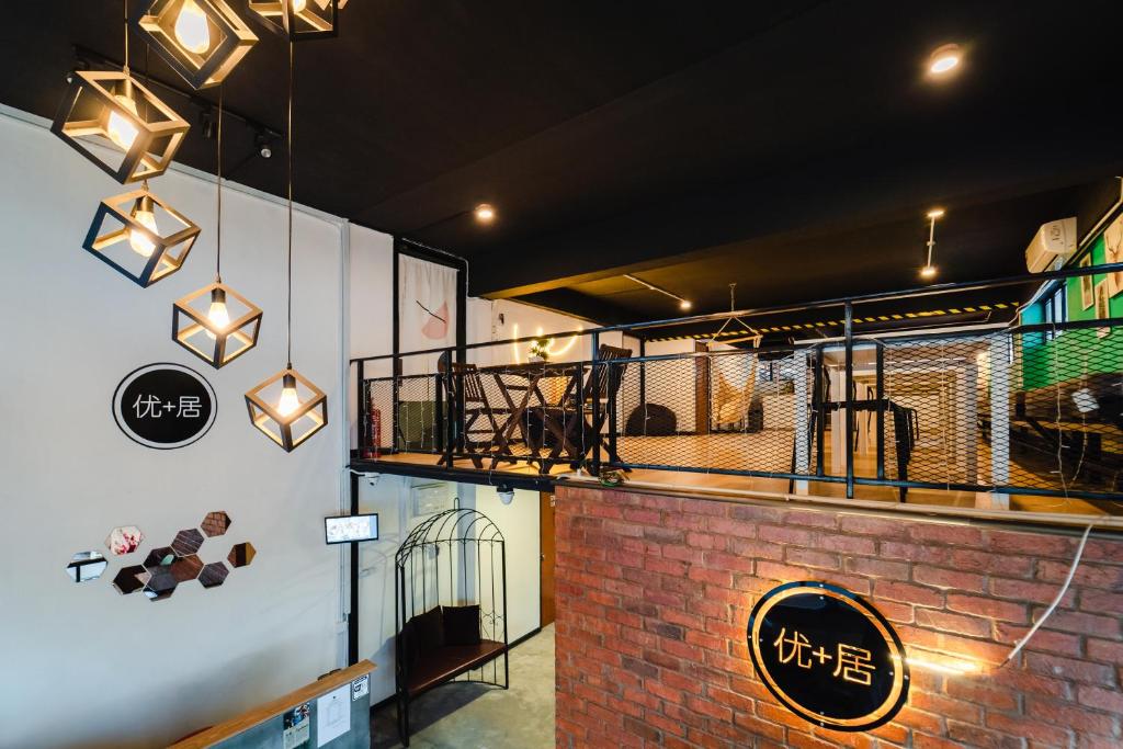 a restaurant with a brick wall and lights on the wall at Perfect Hub Semporna in Semporna