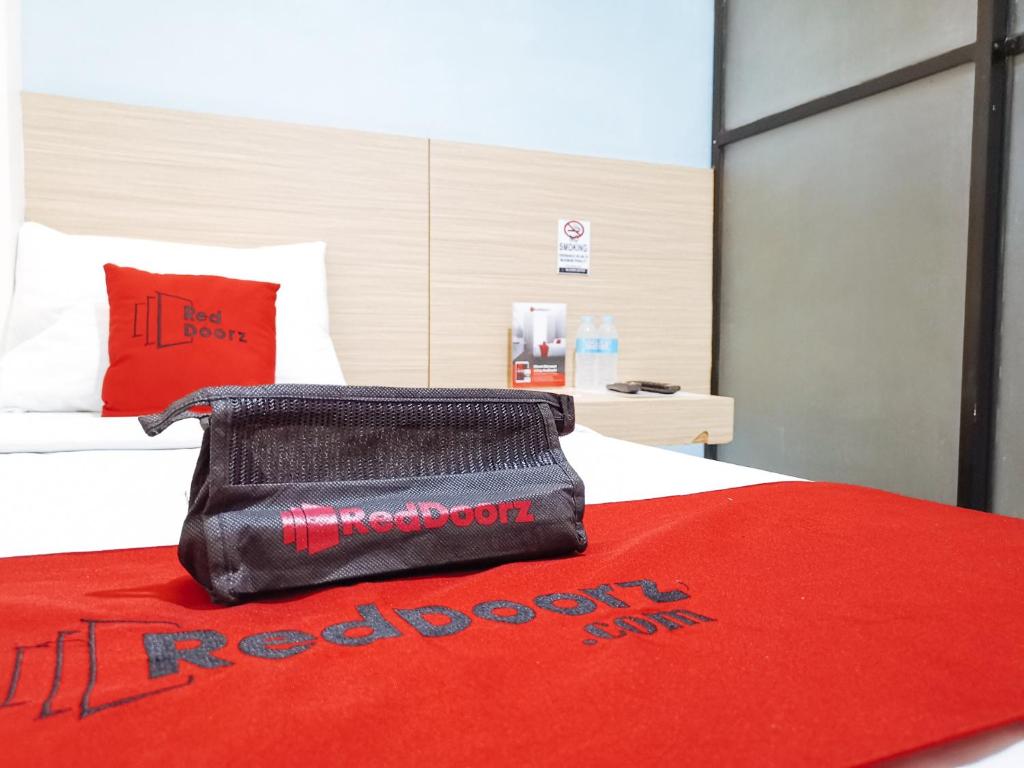 Postel nebo postele na pokoji v ubytování RedDoorz near Trade School Gensan