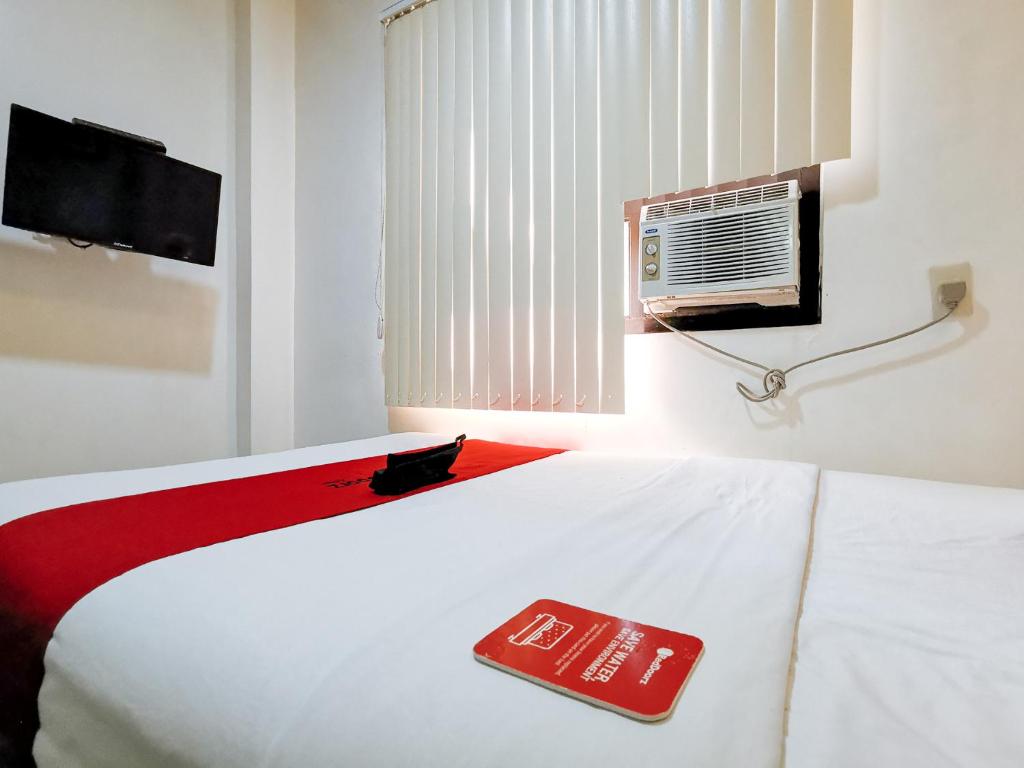 Postel nebo postele na pokoji v ubytování RedDoorz near Trade School Gensan