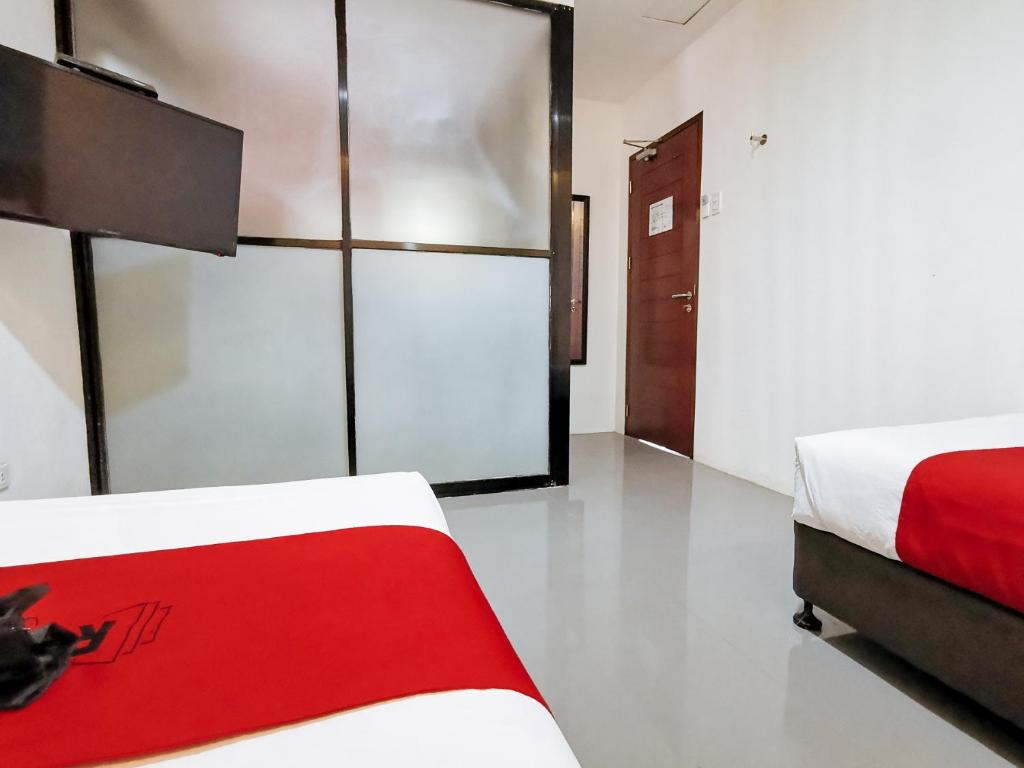 Postel nebo postele na pokoji v ubytování RedDoorz near Trade School Gensan