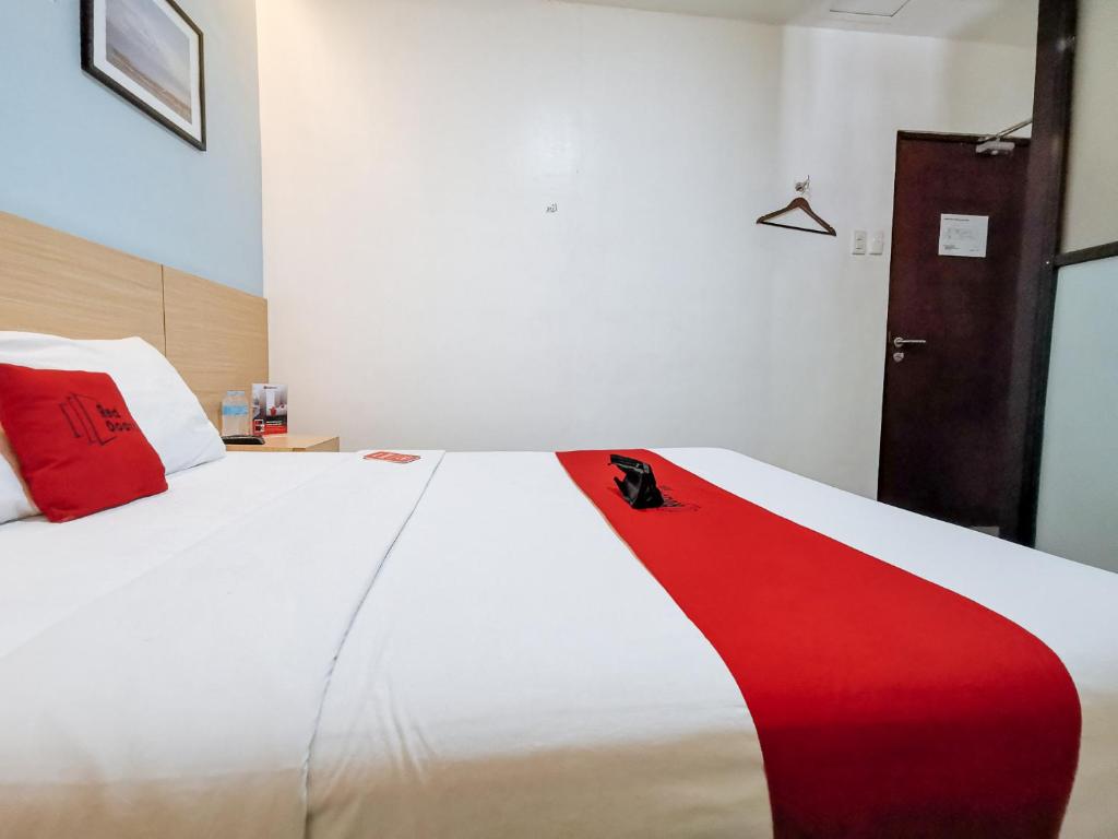 Postel nebo postele na pokoji v ubytování RedDoorz near Trade School Gensan