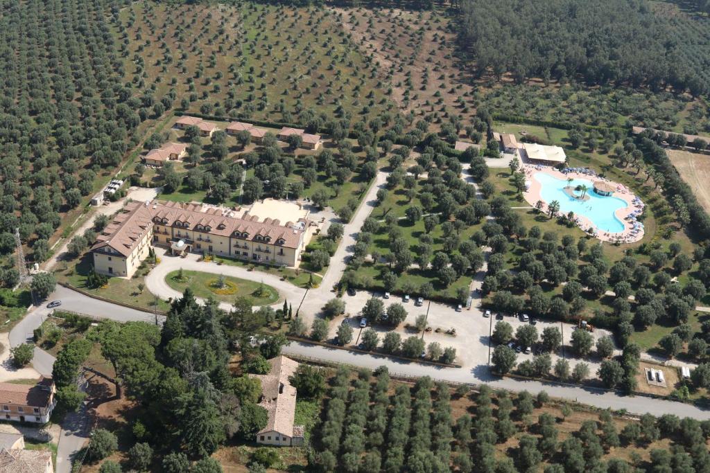 an aerial view of a resort with a pool and trees at Uliveto Principessa Resort in Cittanova