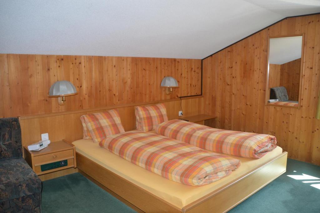 Postel nebo postele na pokoji v ubytování Hotel Seeblick