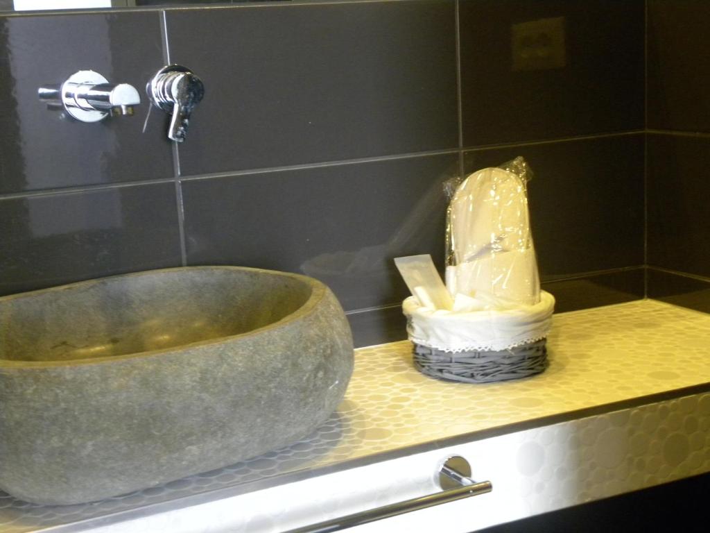 a bathroom counter with a sink and a tub at Corte Del Gallo in Corniglia
