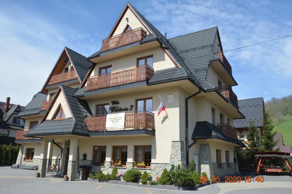 a large building with balconies on top of it at Willa Wiktoria 2 in Zakopane