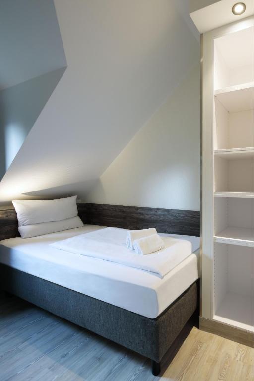 Postel nebo postele na pokoji v ubytování Dorint Resort Winterberg