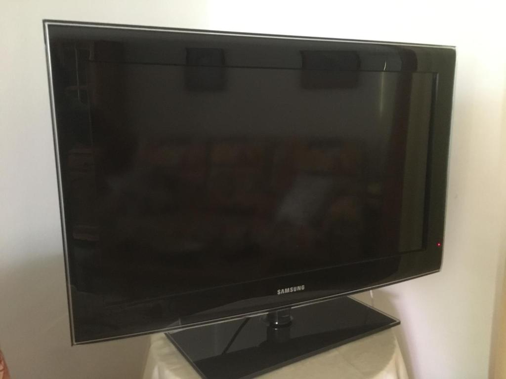 TV a/nebo společenská místnost v ubytování Casa Angeles