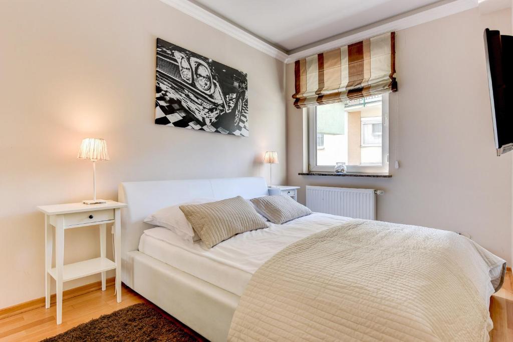 Łóżko lub łóżka w pokoju w obiekcie Apartamenty Molo Gorny Sopot