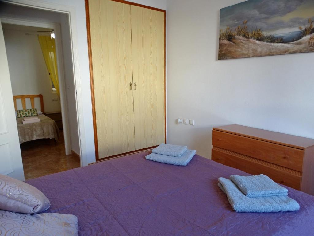 Posteľ alebo postele v izbe v ubytovaní Apartamento Laguna Rosa