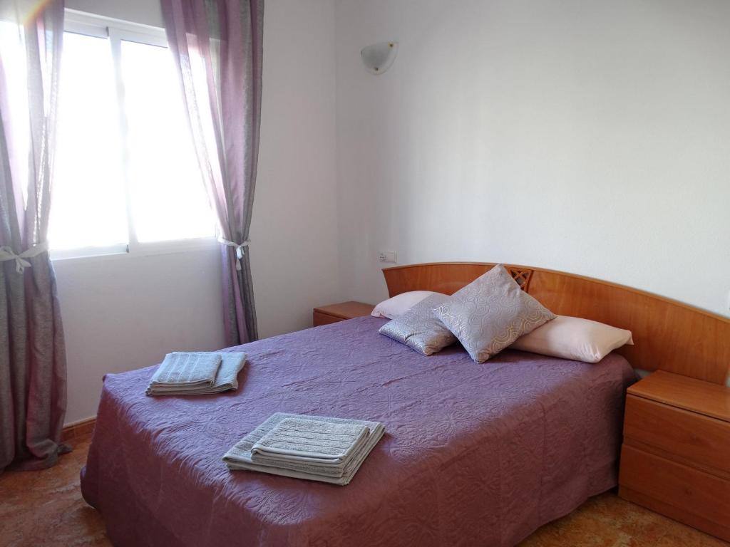 Posteľ alebo postele v izbe v ubytovaní Apartamento Laguna Rosa