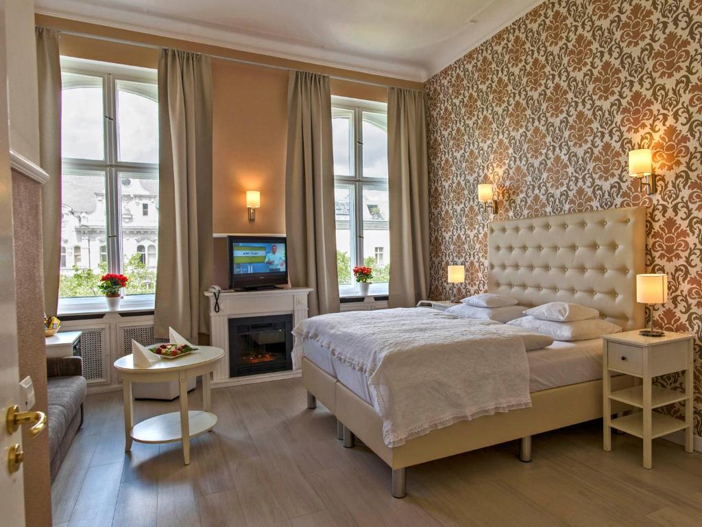 Postel nebo postele na pokoji v ubytování Hotel Augusta Am Kurfürstendamm