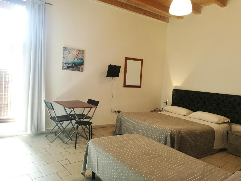 Postel nebo postele na pokoji v ubytování Corte Del Borgo Antico