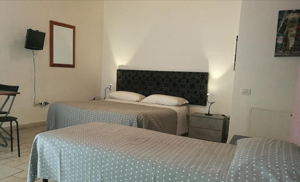 Postel nebo postele na pokoji v ubytování Corte Del Borgo Antico