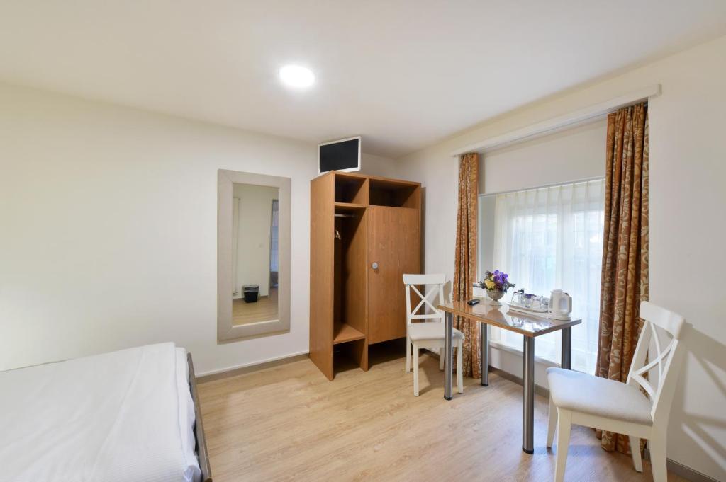 Postel nebo postele na pokoji v ubytování Hotel Hirschen