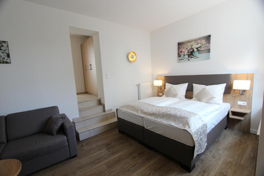 Postel nebo postele na pokoji v ubytování Hotel Adler