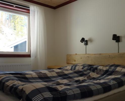 Postel nebo postele na pokoji v ubytování Funäsdalens Stugby