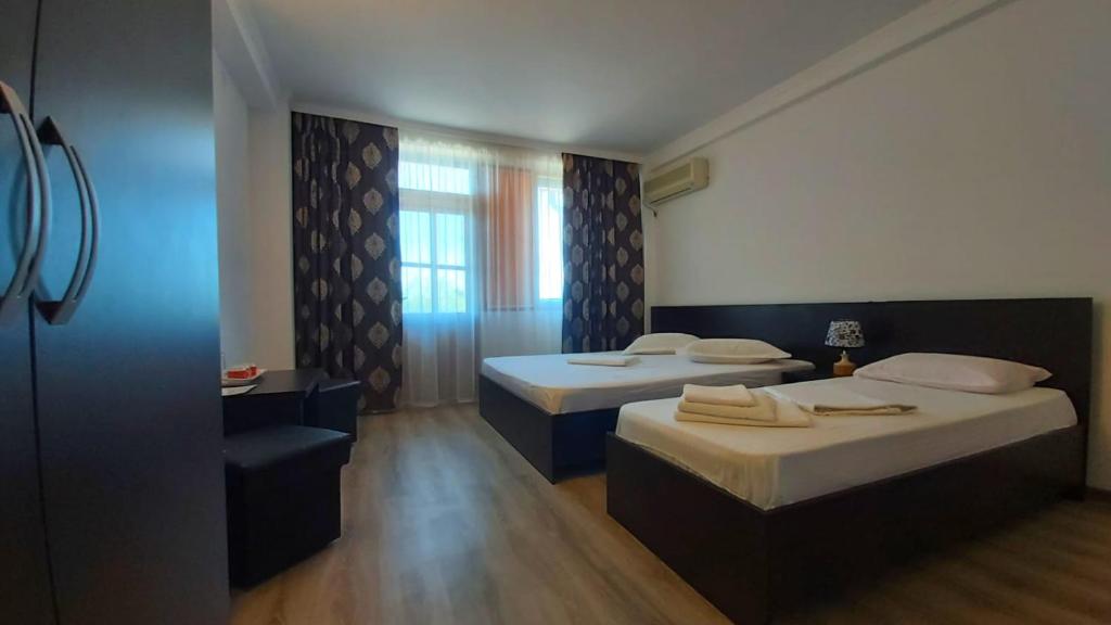 Postel nebo postele na pokoji v ubytování Vila Egreta