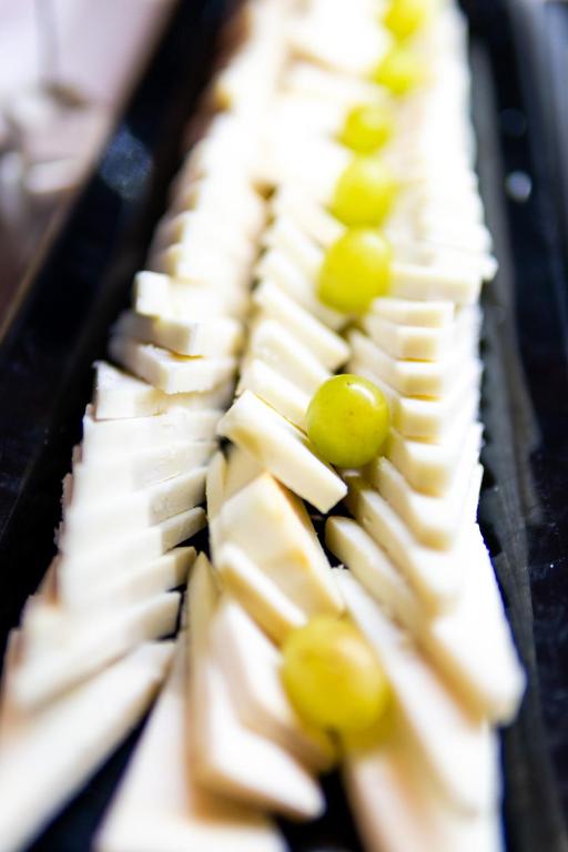 a bunch of cheese and grapes on a plate at Parador de La Gomera in San Sebastián de la Gomera